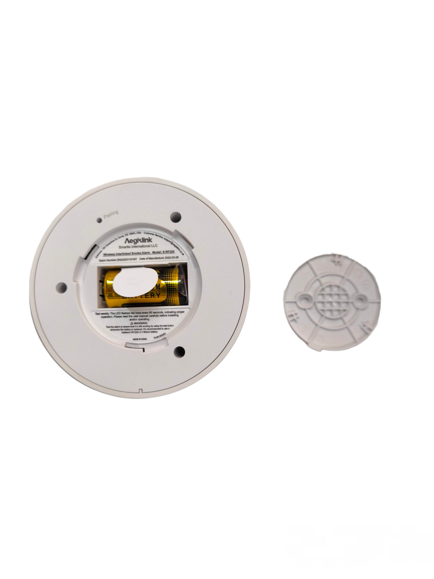 Aegislink Wireless Interlinked Smoke Alarm showing battery compartment and back cover removed
