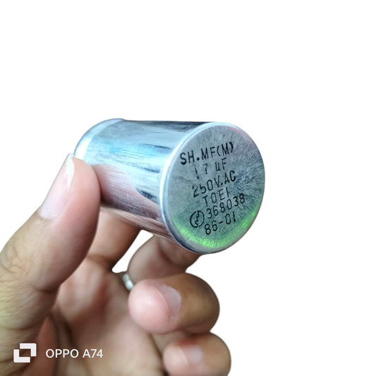 1.7UF motor running capacitor held in hand made in Japan for electrical circuitry and parts
