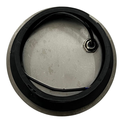 Metallic component with a black rim on a white background