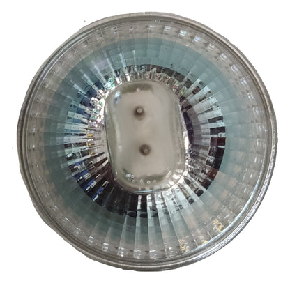 Circular metallic object with reflective surface on a white background