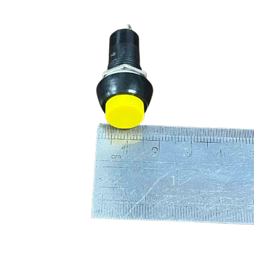 1A Monetary Switch 220V - Yellow Push Button Switch with Measuring Ruler for Size Reference