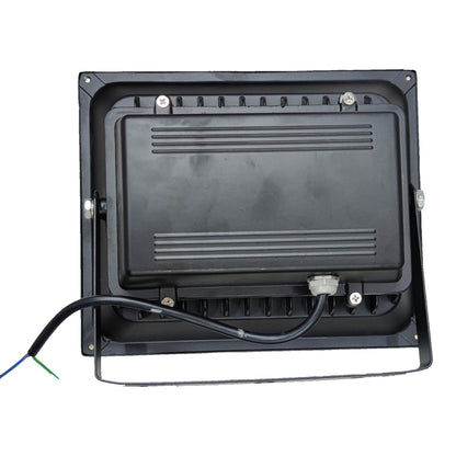 Black rectangular electronic device with wiring on a white background