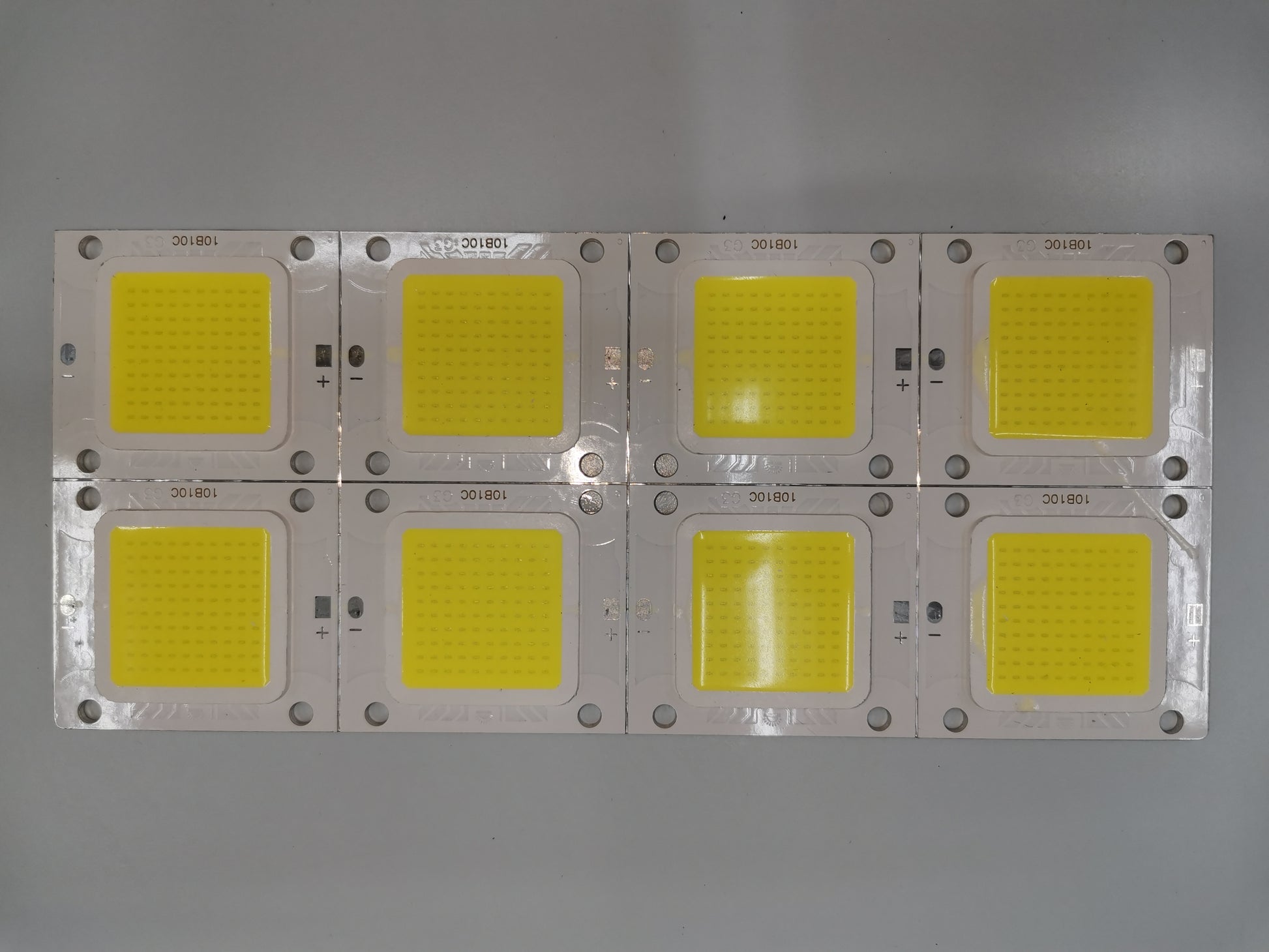 Set of eight 20W high power LED chip modules arranged on a metal board for LED bulbs and strips