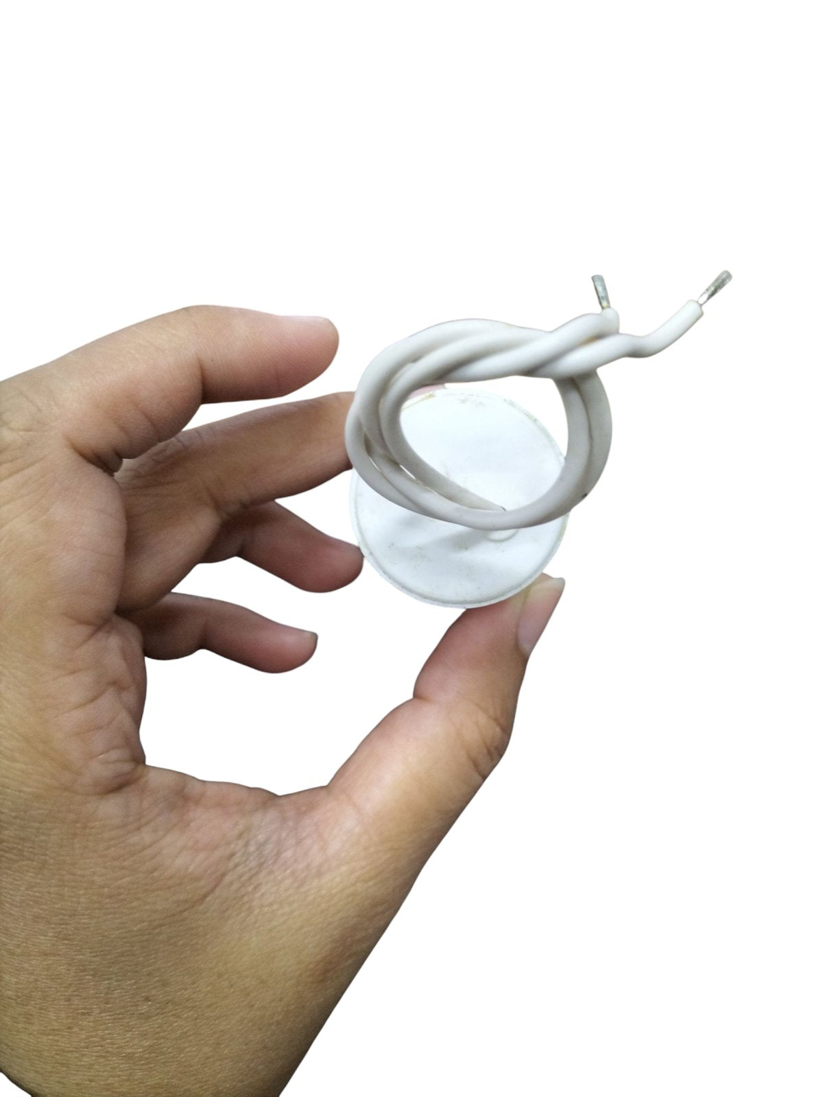 Hand holding a Syscap 250V AC Motor Running Capacitor with wires for electrical applications