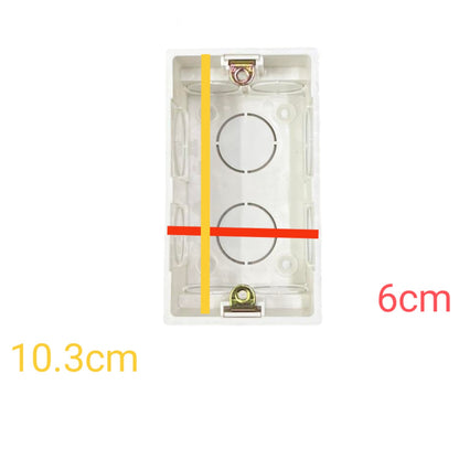 A clear plastic electrical junction box shown on a white background with dimension annotations: 10.3cm vertical height, 6cm width, and a yellow vertical measurement line plus a red horizontal measurement line overlaid on the product.