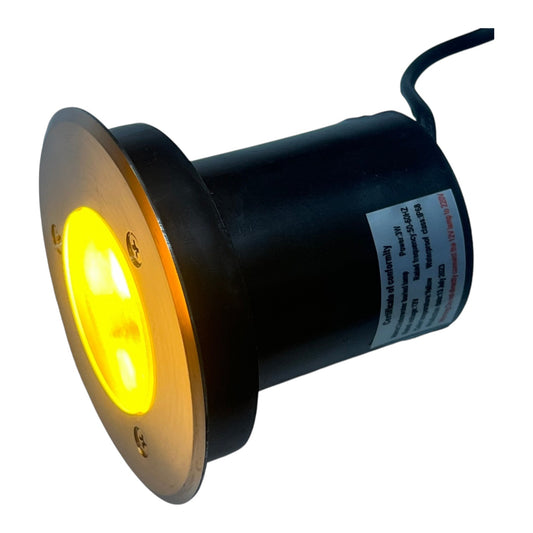Black LED light bulb with yellow glow on a white background