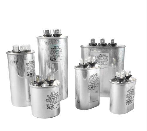 Various sizes of Mallory 440V cylindrical aluminum can capacitors with terminal connections