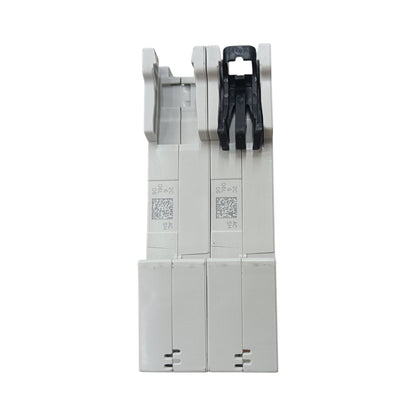 A pair of industrial electrical circuit breakers, likely Siemens ABB components, shown from the front against a plain white background. The main body is white plastic with a black plastic latch mechanism on the right side.