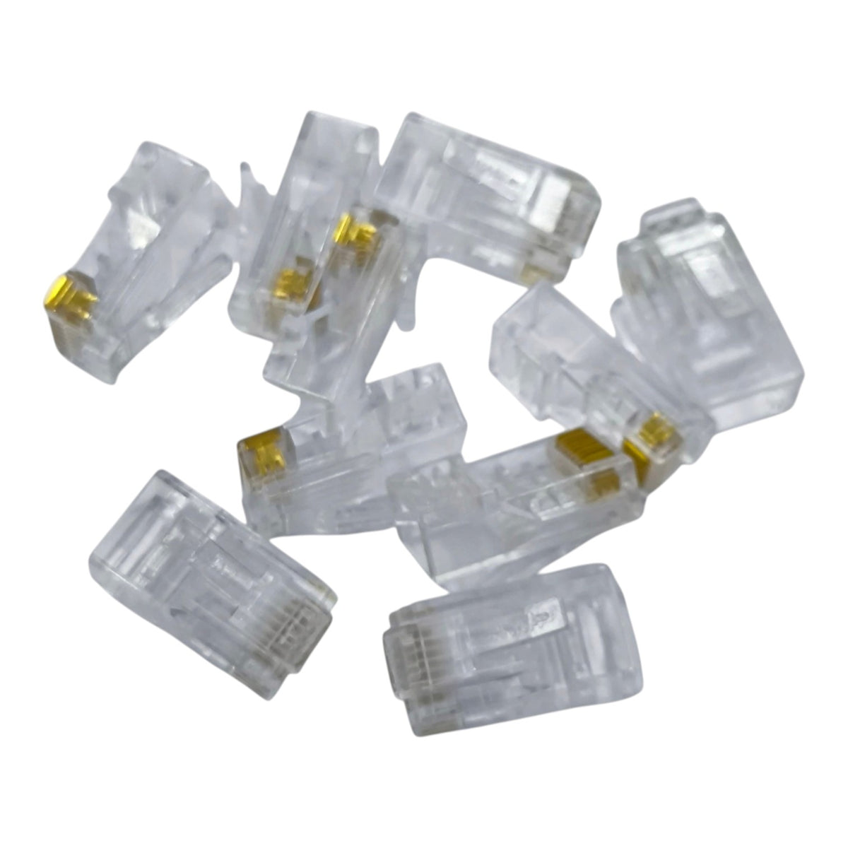 A pile of clear plastic RJ45 network connectors with gold-plated internal contacts, shown on a plain white background.