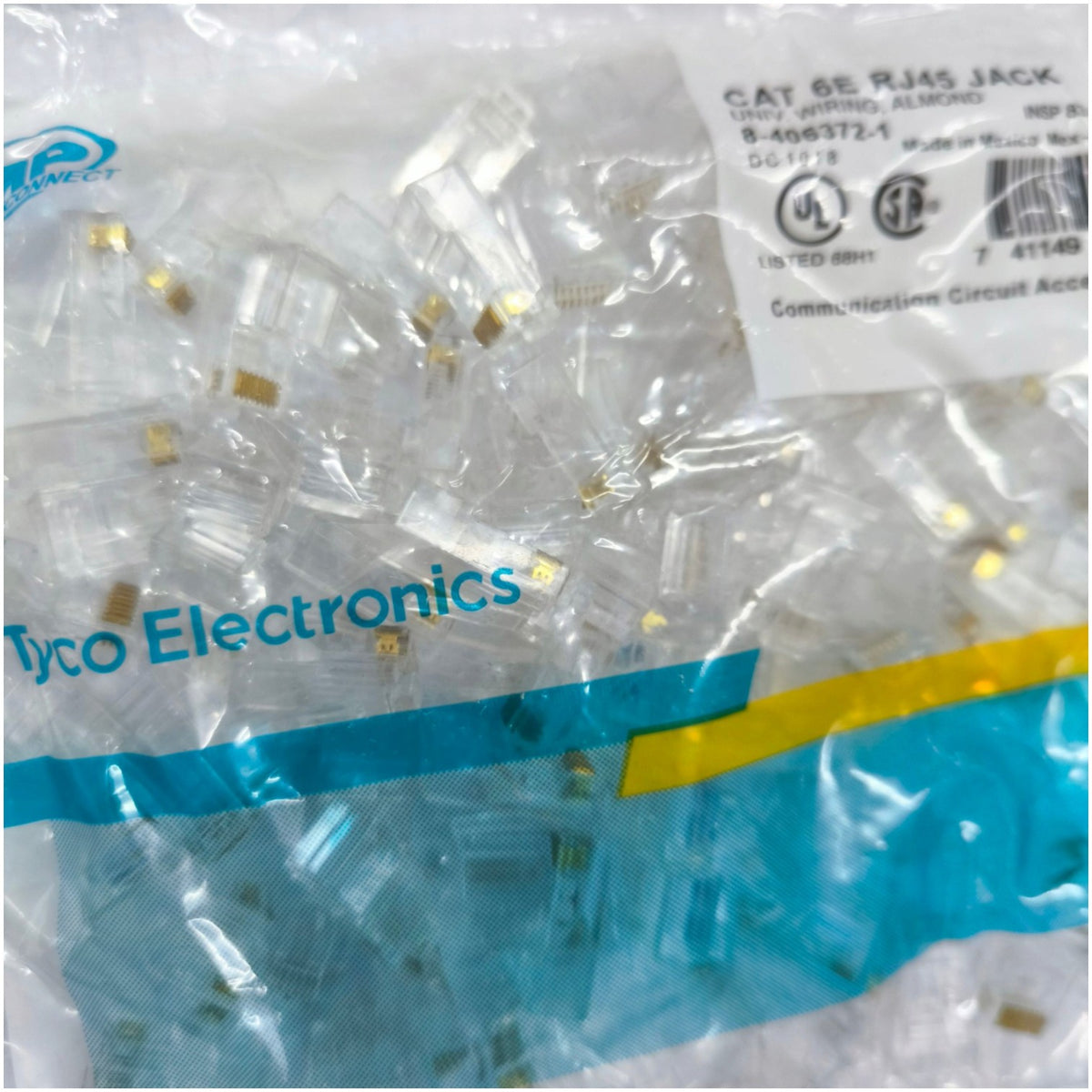 Tyco Electronics CAT 6 RJ45 Jack communication circuit accessories in a clear plastic bag with blue and yellow branding.