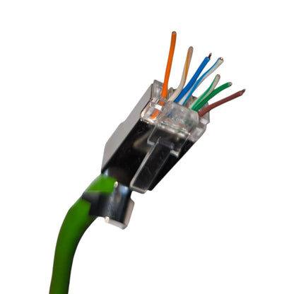 A close-up of a green Ethernet cable connector showing the internal RJ45 plug with eight colored wires exposed, set against a plain white background.