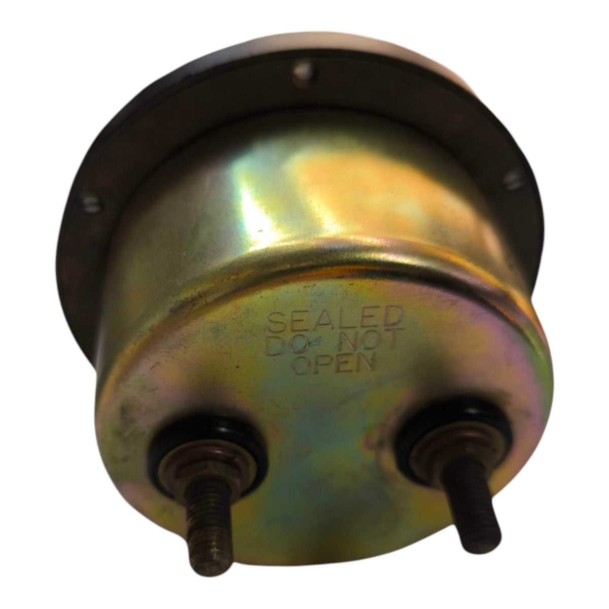 A cylindrical metal mechanical component, likely a pump or filter housing, featuring a flanged top with mounting holes and two threaded ports. The surface has a metallic gold and green iridescent finish, and the words 'SEALED DO NOT OPEN' are embossed on the front.