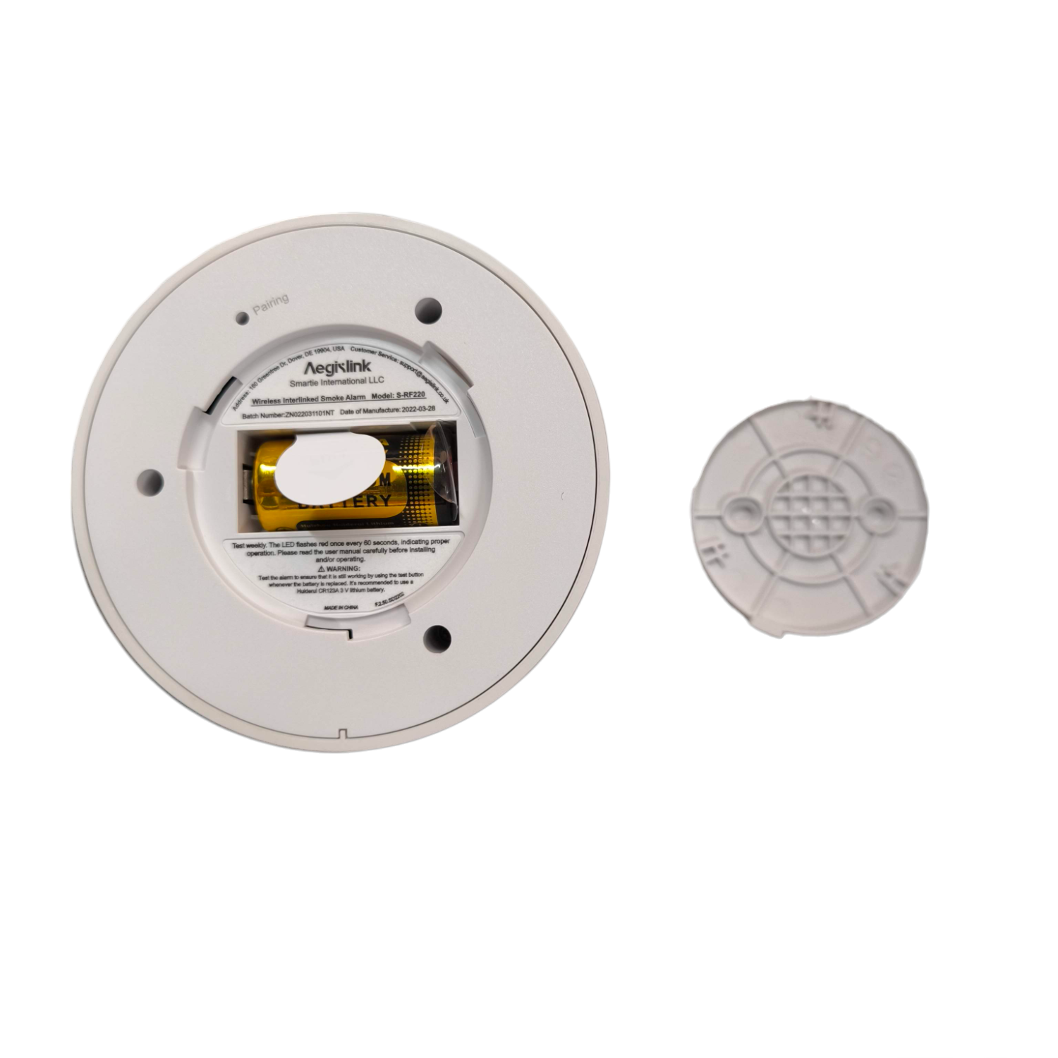 Aegislink Wireless Interlinked Smoke Alarm showing battery compartment and back cover removed