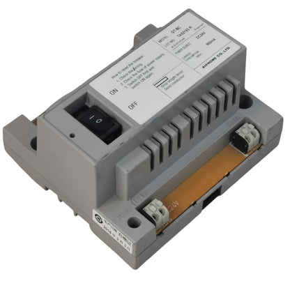 An industrial electrical relay module by Omron, featuring a gray plastic housing, a black toggle switch, a white printed technical label, and a copper-colored internal circuit board visible at the bottom.
