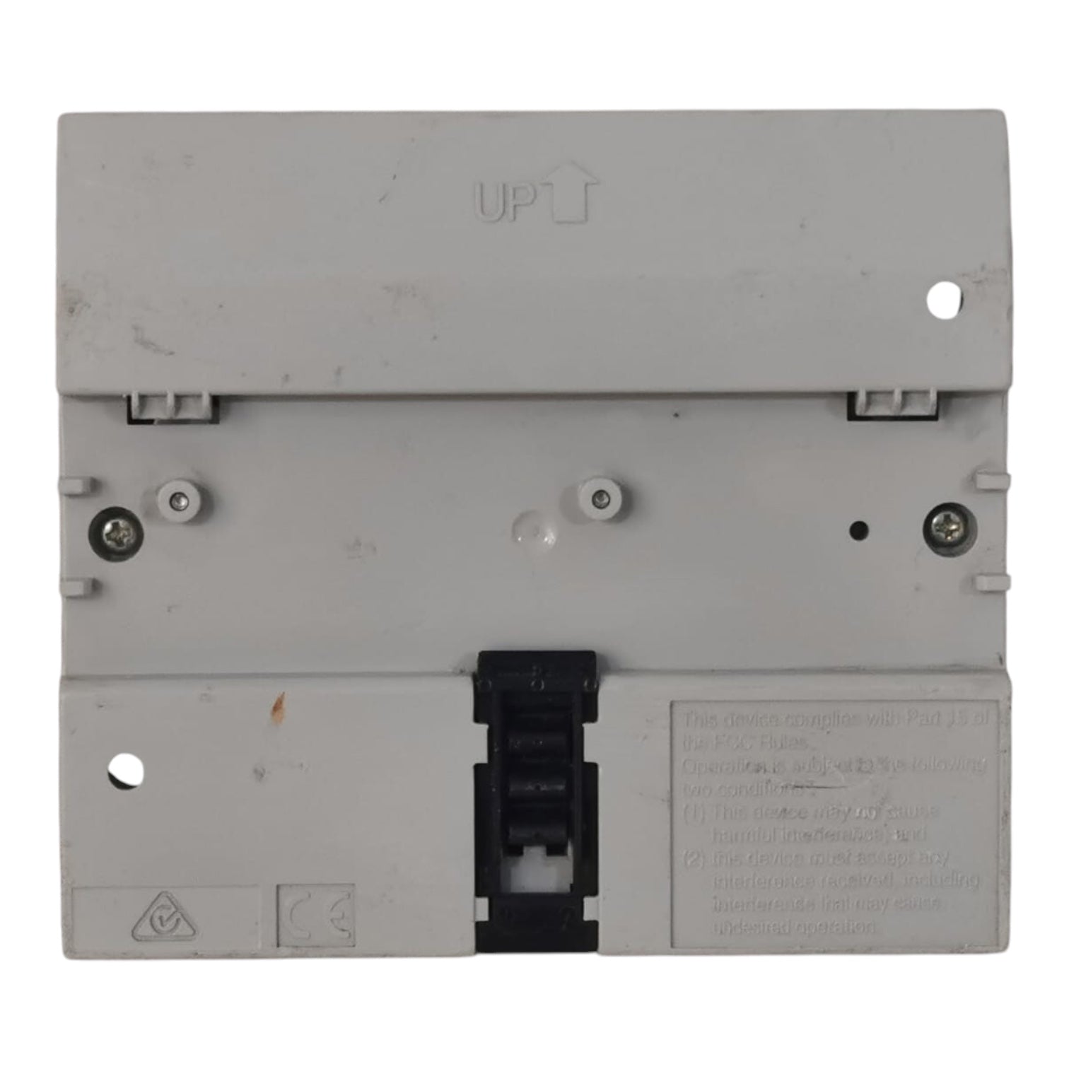 A light gray plastic electrical component or terminal block with a black central connector cover, photographed against a plain white background.