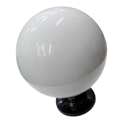 A white spherical globe lamp or light fixture with a glossy finish, mounted on a black circular base against a plain white background.