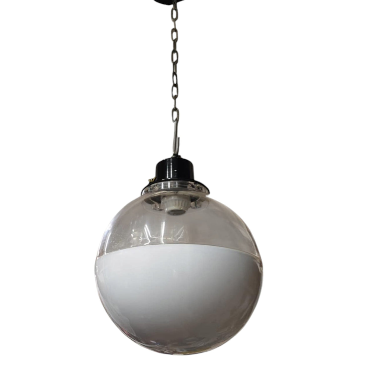 A spherical pendant light with a clear glass globe shade, half of which is frosted white, hanging from a dark metal chain against a plain white background.