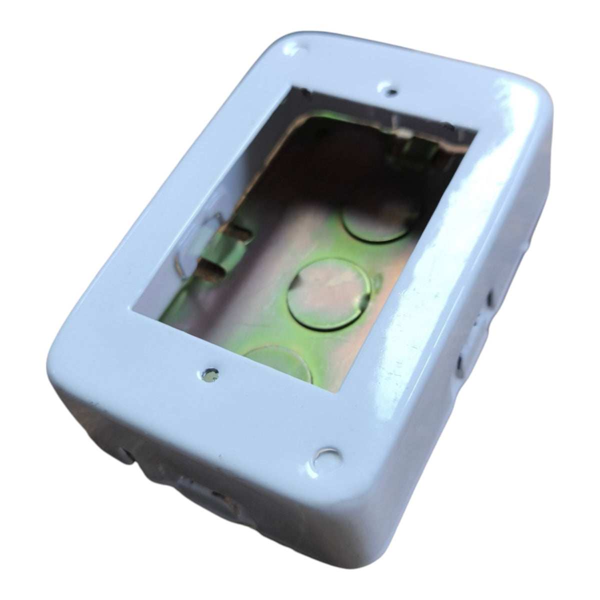 A white rectangular electrical junction box cover with a cutout window showing the interior metal tray and terminal holes, isolated on a white background.