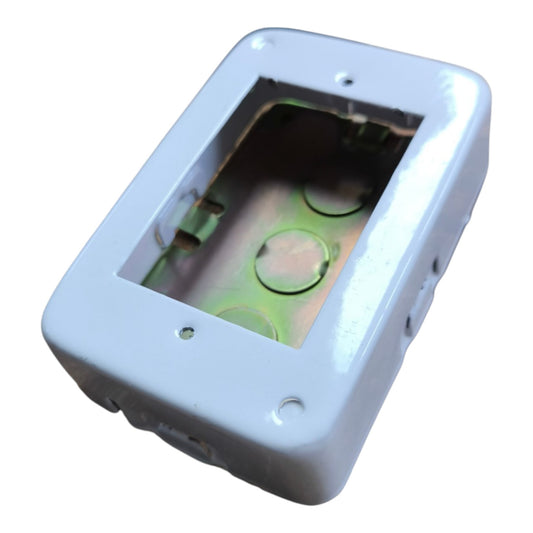 A white rectangular electrical junction box cover with a cutout window showing the interior metal tray and terminal holes, isolated on a white background.