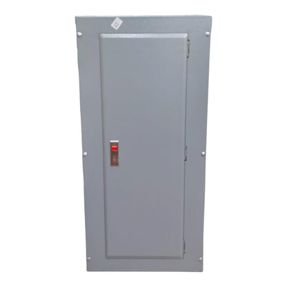 A gray metal electrical panel or cabinet with a single door, featuring a small red switch and a small white sticker near the top, shown against a plain white background.