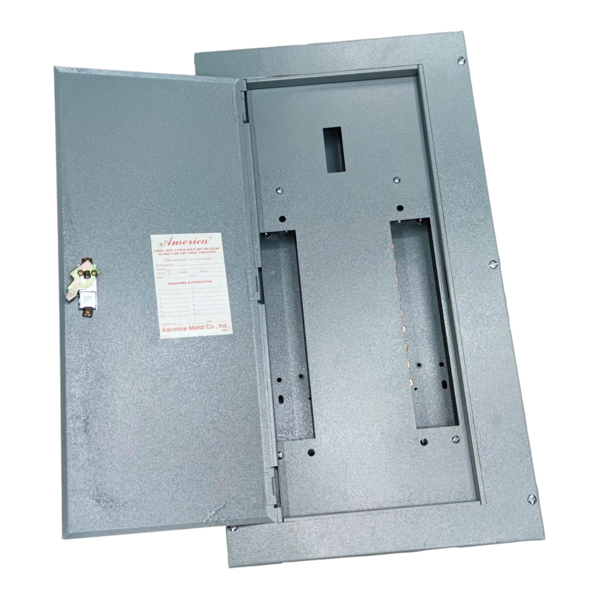 A gray metal electrical panel with the door open, showing the interior mounting slots and a small label on the left side, photographed on a plain white background.