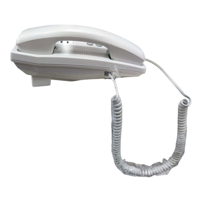 A white corded landline telephone with a coiled handset cord, shown against a plain white background.