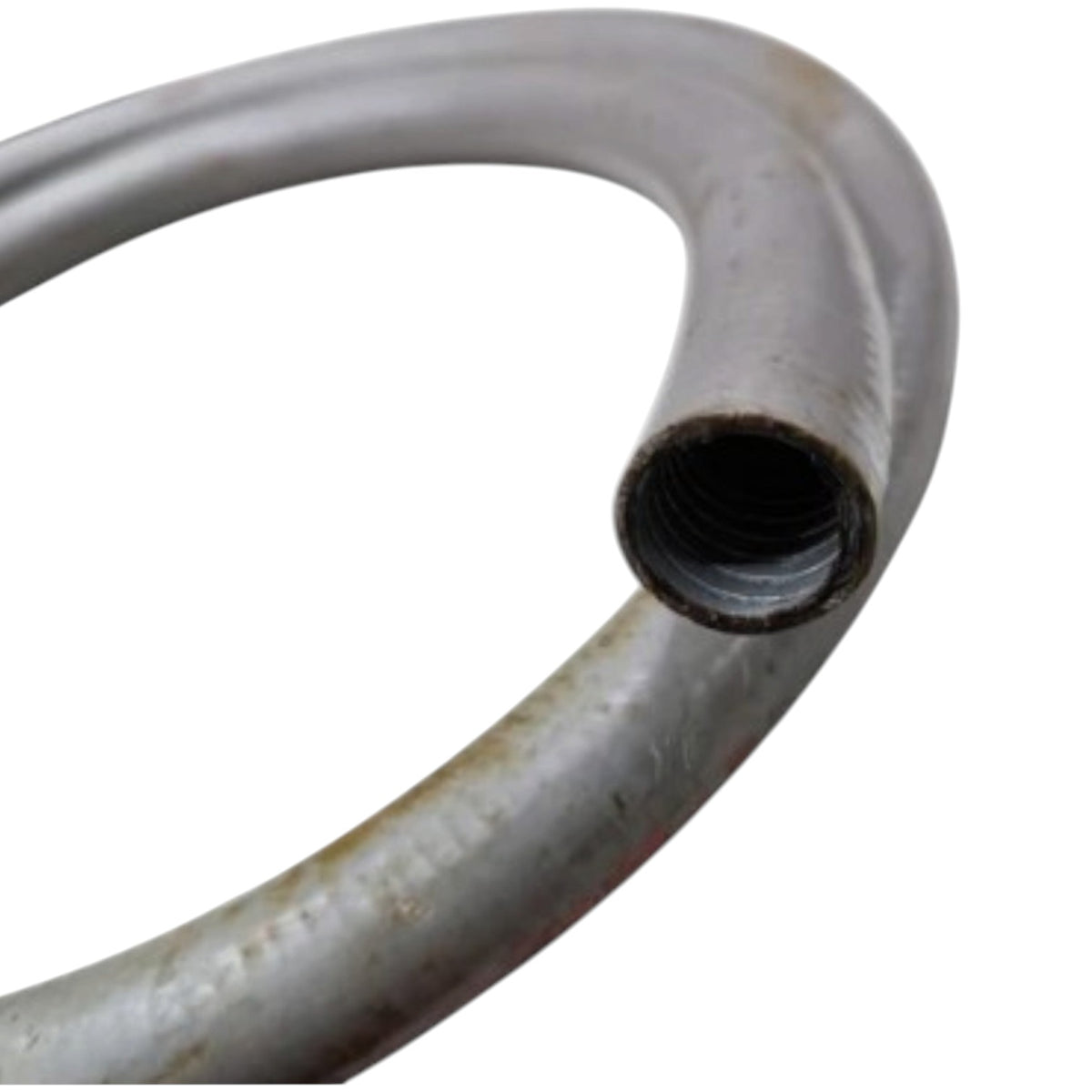 A close-up of a curved metal pipe or hose section with a threaded female end, showing a textured metallic surface on a plain white background.