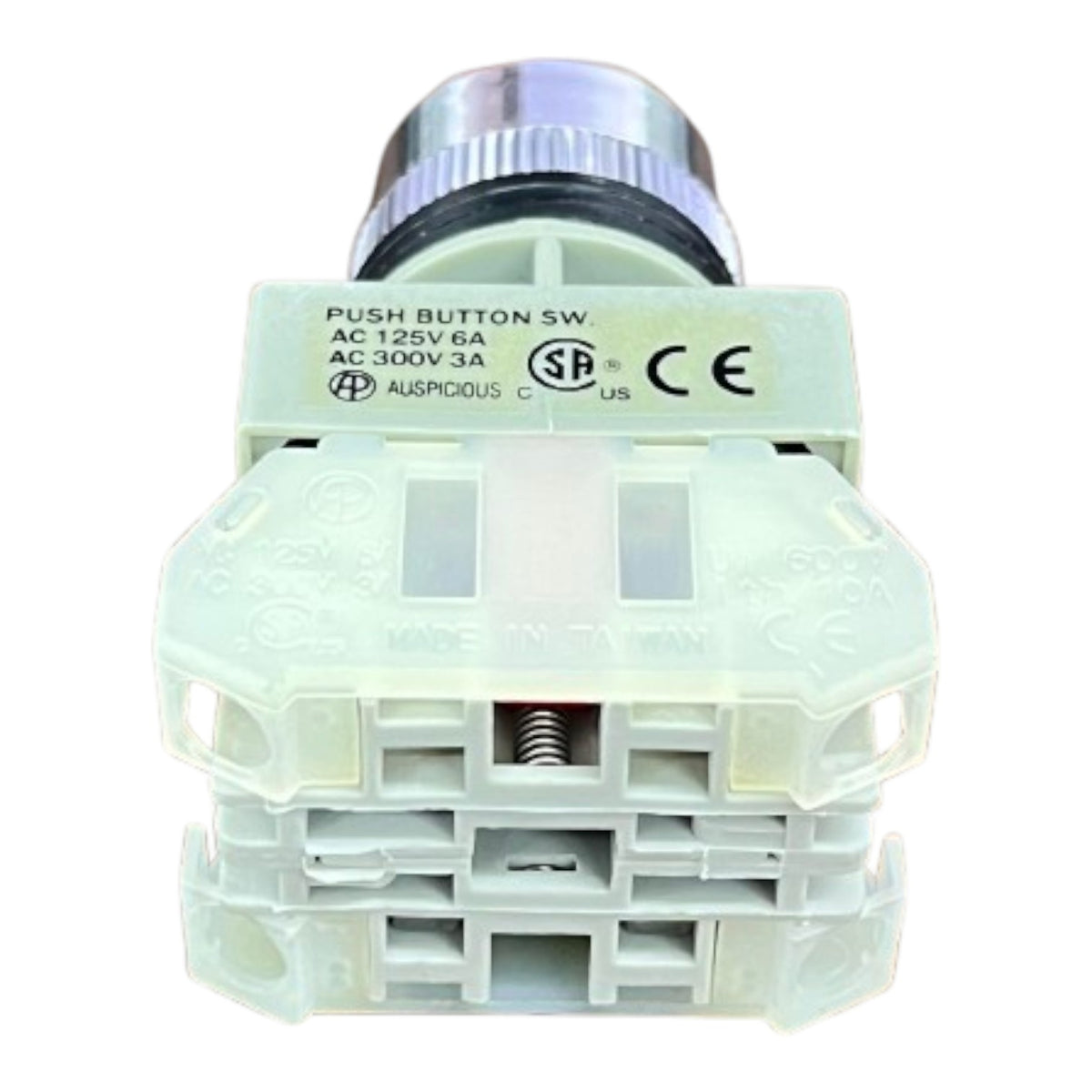 A white plastic industrial push button switch module with a silver metal terminal connector, featuring printed technical specifications and certification logos on top.