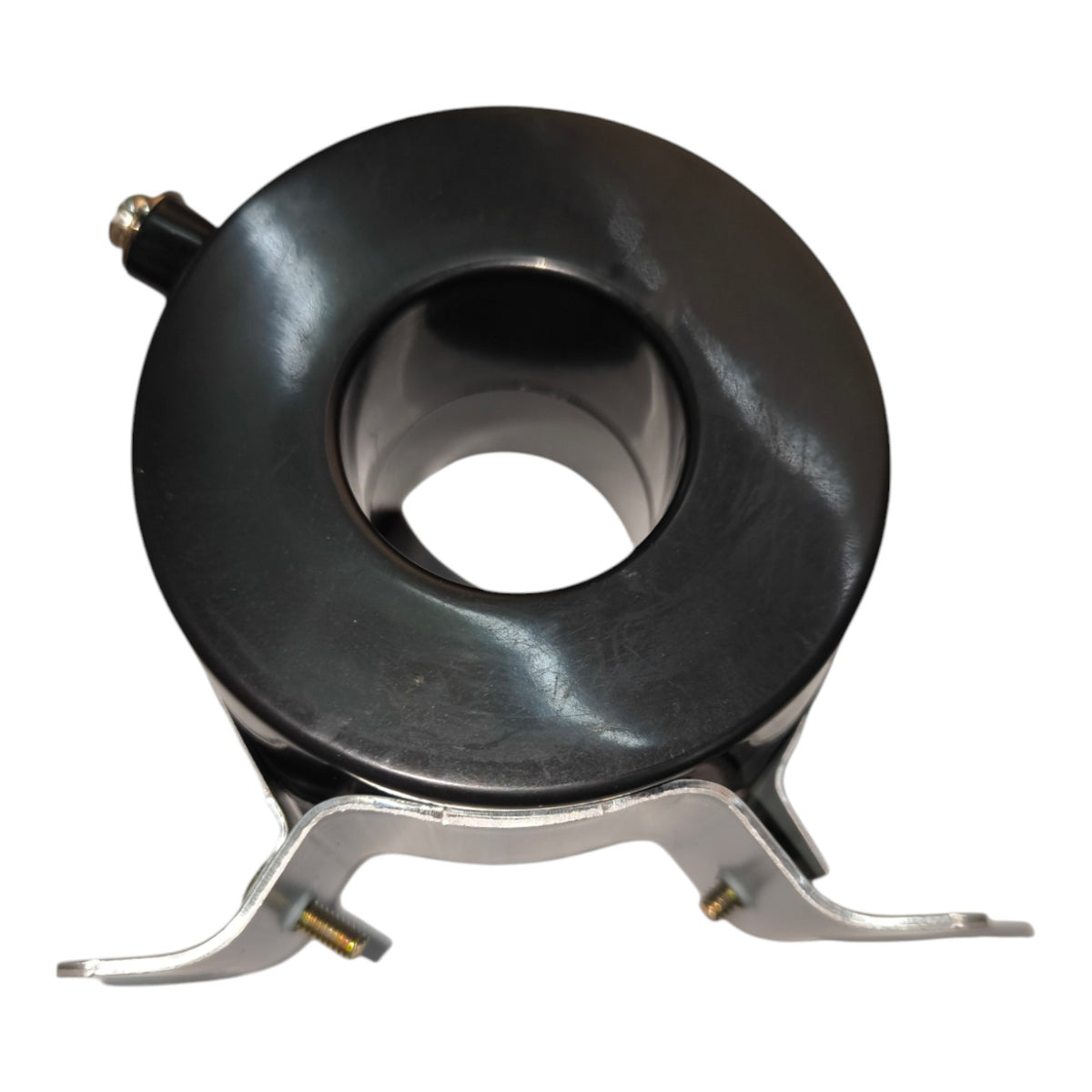 A black circular ring-shaped component with a central hole, mounted on a silver metal bracket with two small gold-toned screws, shown on a plain white background.