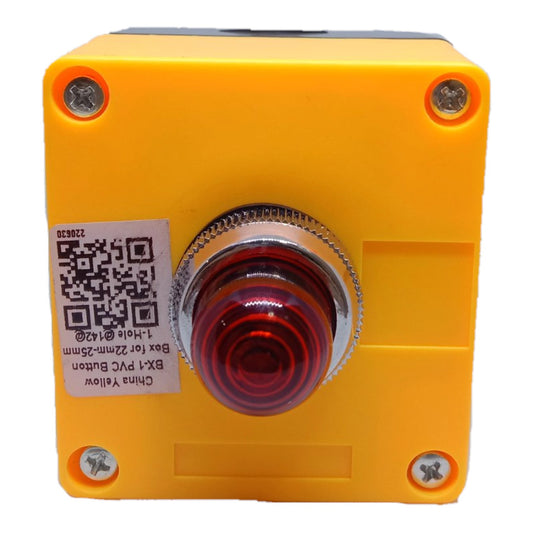 A yellow industrial push-button module with a red lens cover and a white product label on the side, photographed against a white background.