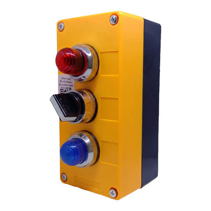 Industrial electrical control panel featuring a yellow and black plastic housing with a red emergency stop button, a black toggle switch, and a blue start button.
