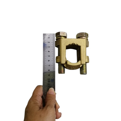 B-B Solderless Connector 2 Bolt brass ground clamp shown with ruler and hand for size reference B-B Solderless Connector Double Bolt 380mm - 500mm Copper 750-1000MCM Electx Electrical Supply