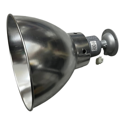A large industrial dome-shaped metal light fixture with a brushed silver finish, featuring a mounting bracket and a small white connector plug, shown on a plain white background.