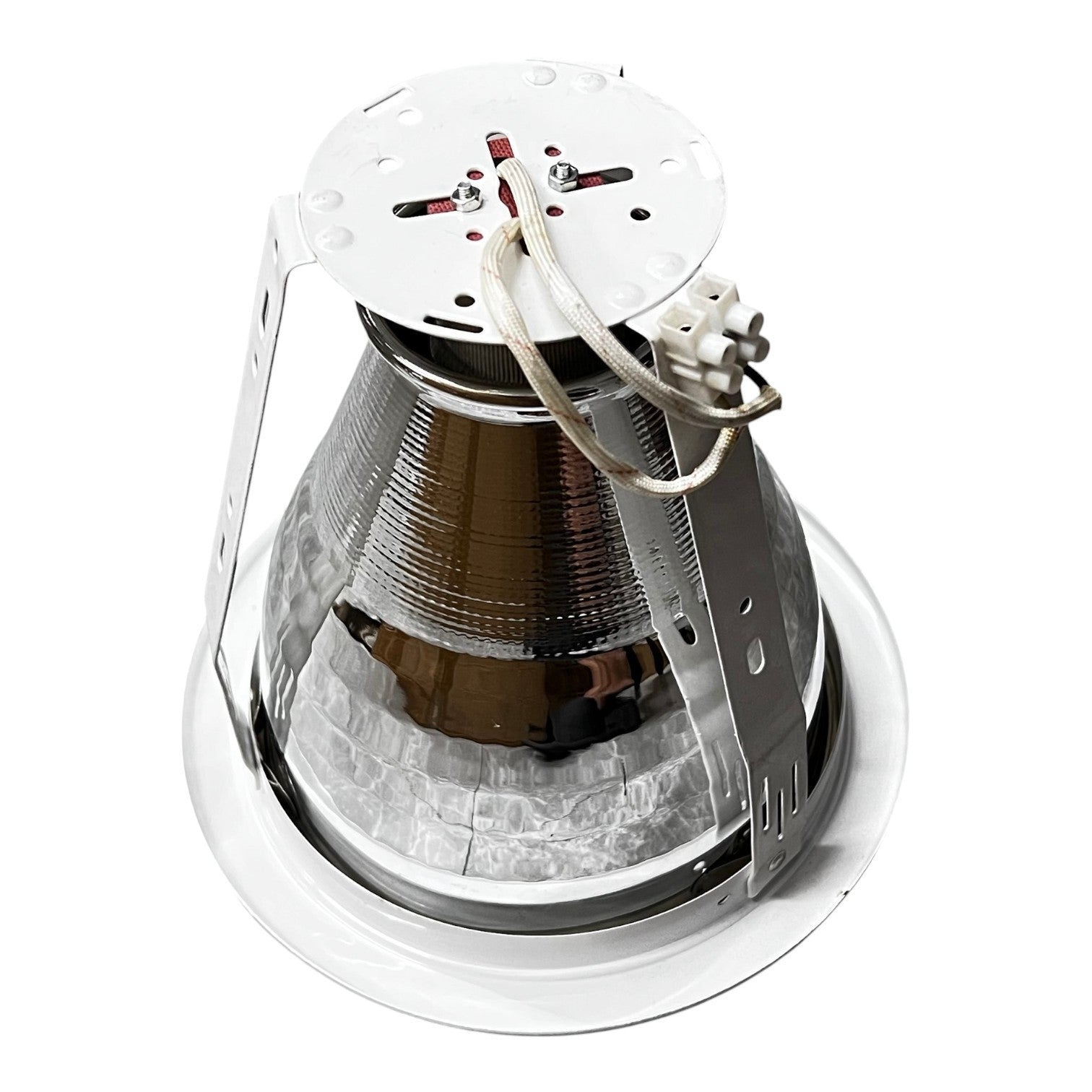 Close-up of a metallic object with a white top on a white background