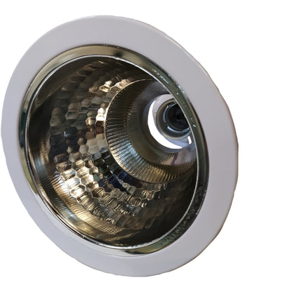 Close-up of a metallic light fixture on a white background