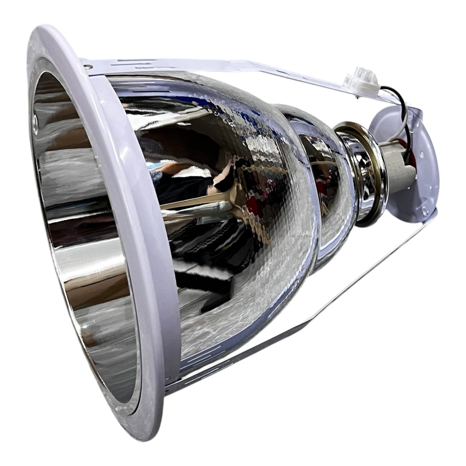 Metallic light bulb reflector on a white background