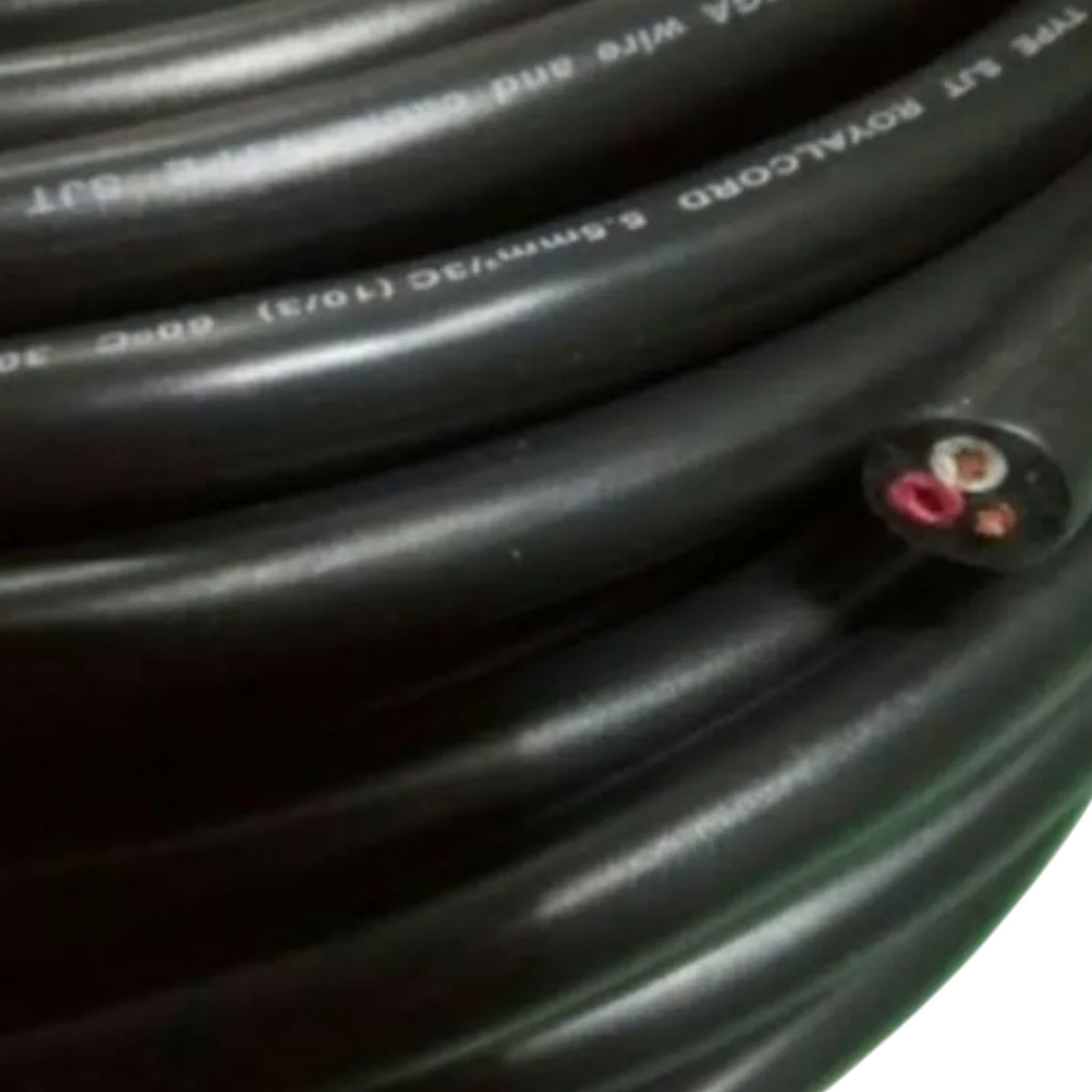 A close-up of a coiled black cable with white printed text and a small exposed cross-section showing red and brown inner wires, photographed against a white background.