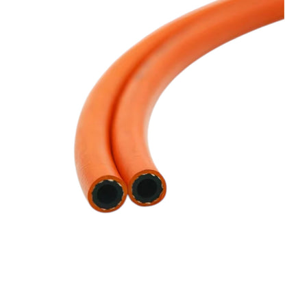 An orange flexible hose or tube shown in a close-up studio shot, curving upward with two open ends visible against a plain white background.