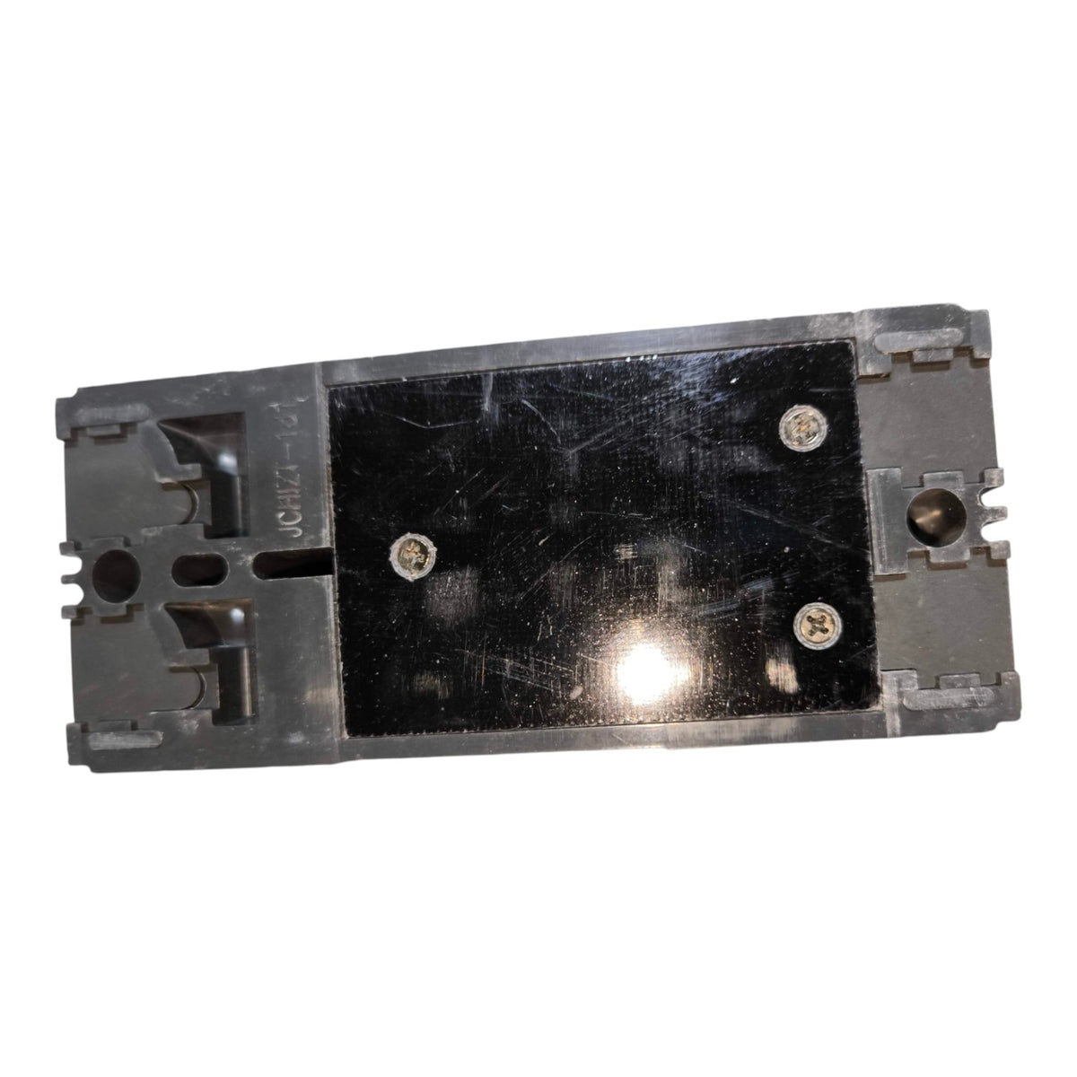 A replacement electronic component, likely a power supply or module, featuring a black central panel secured by four screws, set against a plain white background.