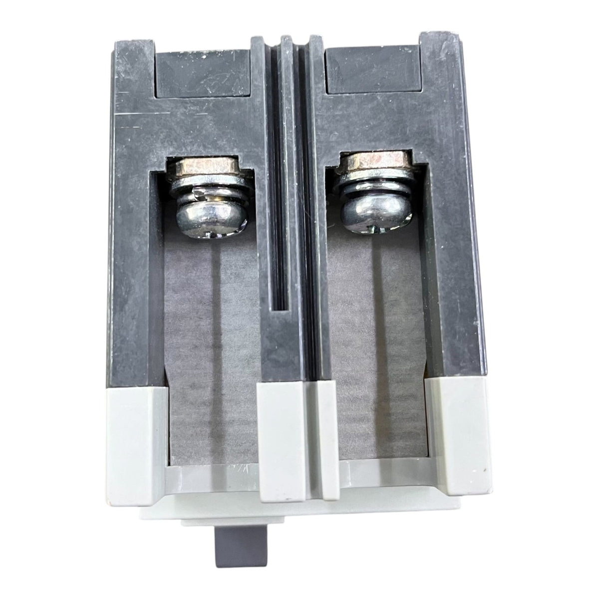 A pair of industrial door stoppers or limit switches with dark gray plastic housings, silver metal ball bearings, and white plastic end caps, shown against a plain white background.