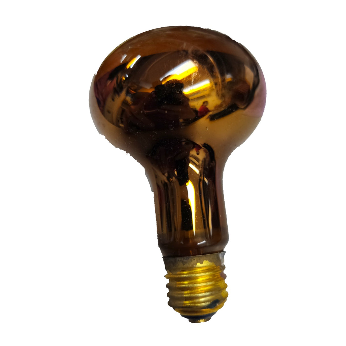 A single amber-colored glass light bulb with a gold screw base, isolated on a white background.