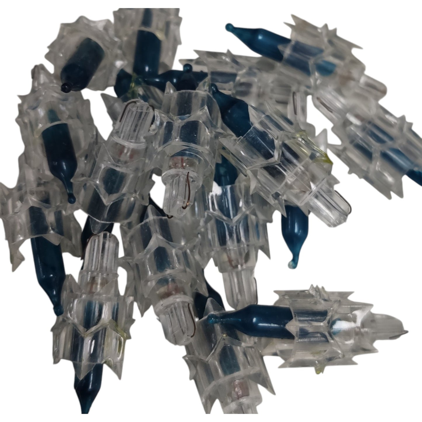 Cluster of clear and blue plastic components on a white background