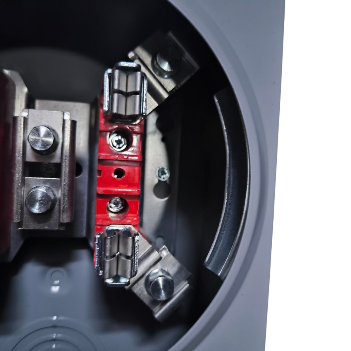 Close-up of a mechanical component with red and silver parts on a dark background