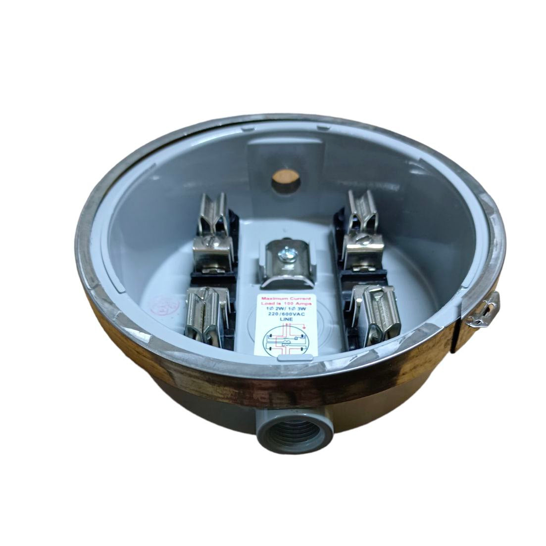 Metallic bowl with electrical components on a white background