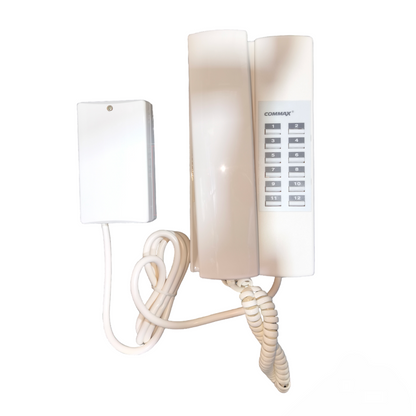 White wall-mounted phone with a small white device on a white background