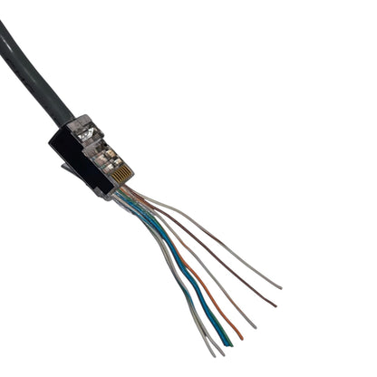 A close-up of a RJ45 Ethernet connector showing the internal twisted pair wires, including blue, orange, brown, white, and gray wires, on a solid white background.