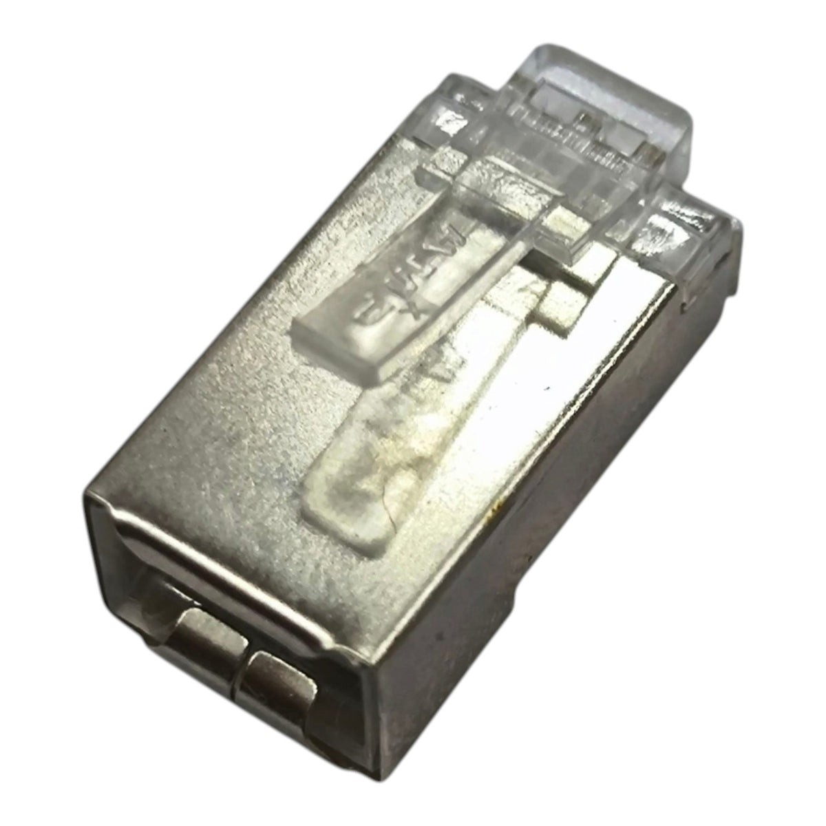 A single RJ45 Ethernet connector module with a silver metal housing and a clear plastic protective cover, shown on a plain white background.