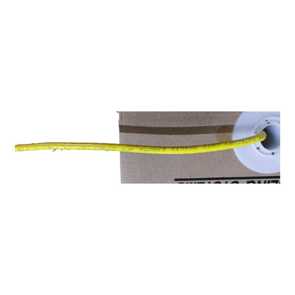 A close-up of a yellow electrical wire spool wound around a white plastic spool, positioned over a brown cardboard box on a white background.