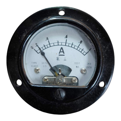 An analog circular ammeter gauge with a black metal housing, white dial face, black needle, and visible mounting hardware, isolated on a white background.