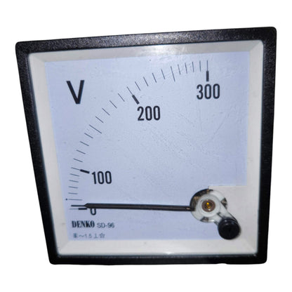A square analog voltmeter gauge with a black frame, white face, and black needle, showing a scale from 0 to 300 with 'V' printed at the top left. The brand name 'DENKO' is visible at the bottom left of the face.
